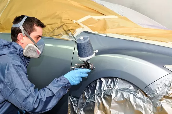 Ultra-glossy light reflection off newly restored factory auto paint body panel